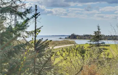 a view of a body of water and trees at Awesome Home In Roslev With Kitchen in Roslev
