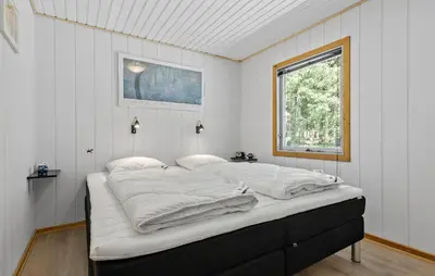 a large bed in a white room with a window at Amazing Home In Farsø With Wifi in Farsø