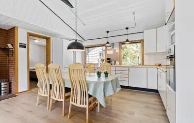 a kitchen and dining room with a table and chairs at Amazing Home In Farsø With Wifi in Farsø