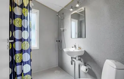 a bathroom with a sink and a toilet and a mirror at 1 Bedroom Gorgeous Home In Vestervig in Vestervig