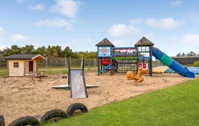 a playground with a slide and a play structure at 1 Bedroom Gorgeous Home In Vestervig in Vestervig