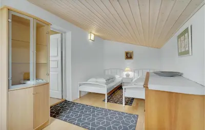 a room with a sink and a bed in a room at 2 Bedroom Awesome Home In Vemb in Vemb