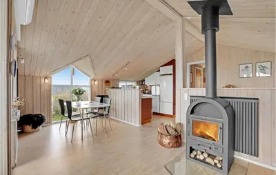 a living room with a fireplace in a house at Stunning Home In Lemvig With Wifi in Lemvig
