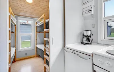 a tiny house with a kitchen and a bedroom at Stunning Home In Hanstholm in Hanstholm