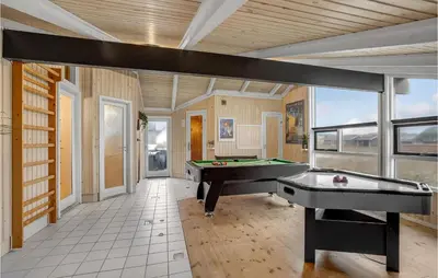 a large room with a pool table in it at Cozy Home In Harboøre With Sauna in Harboør