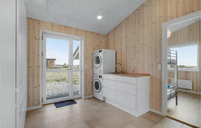 a laundry room with a washer and dryer at Beautiful Home In Løgstrup With Kitchen in Løgstrup