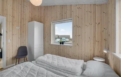 a bedroom with a white bed and a window at Beautiful Home In Løgstrup With Kitchen in Løgstrup