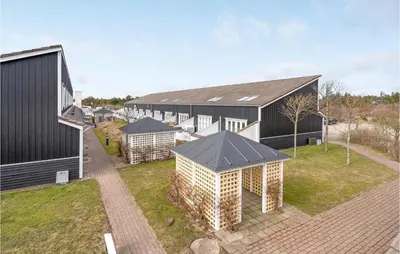 an aerial view of a house with a building at Agger Havn Feriecenter in Vestervig