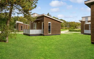 a home with a green yard with houses at Cozy Home In Vestervig With Wifi in Vestervig