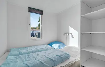 a bedroom with a bed and a window at Cozy Home In Vestervig With Wifi in Vestervig