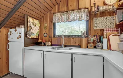 a kitchen with a sink and a white refrigerator at Gorgeous Home In Roslev With Wifi in Roslev