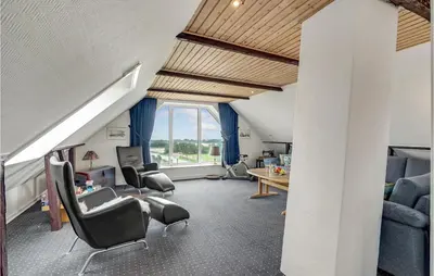 a living room with chairs and a table at Gorgeous Home In Lemvig With Wifi in Lemvig