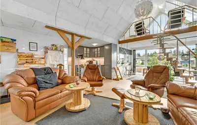 a living room with leather couches and tables at 3 Bedroom Beautiful Home In Vemb in Vemb