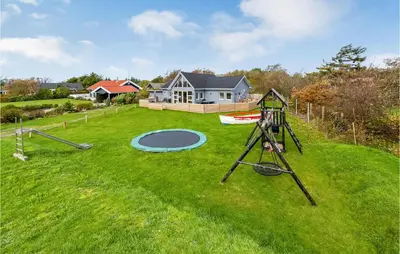 an aerial view of a yard with a playground at 3 Bedroom Beautiful Home In Vemb in Vemb