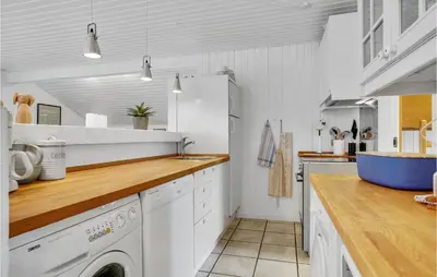 a kitchen with white cabinets and a dishwasher at Lovely Home In Thisted With Wifi in Thisted