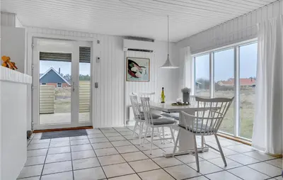 a kitchen and dining room with a table and chairs at Lovely Home In Thisted With Wifi in Thisted