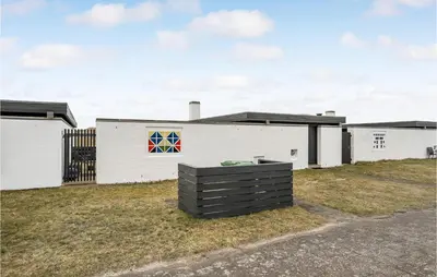 a building with a colorful quilt on the side of it at Awesome Home In Pandrup With Wifi in Pandrup