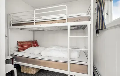 a bedroom with two bunk beds in a room at 1 Bedroom Lovely Home In Løgstør in Løgstør