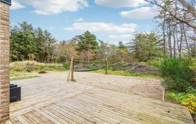 a volleyball court with a net on a wooden deck at Beautiful Home In Vestervig With Wifi in Vestervig