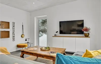a living room with a couch and a table at Beautiful Home In Vestervig With Wifi in Vestervig