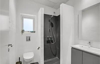 a bathroom with a shower and a toilet and a sink at Beautiful Home In Vestervig With Wifi in Vestervig
