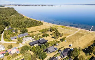 an aerial view of a house next to the water at Awesome Home In Thyholm With Wifi in Thyholm