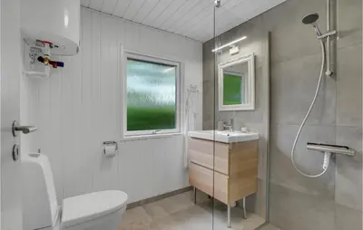 a bathroom with a toilet and a sink and a shower at Stunning Home In Vemb With Wifi in Vemb