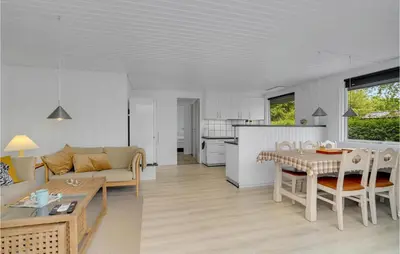 a living room with a couch and a table at Stunning Home In Vemb With Wifi in Vemb