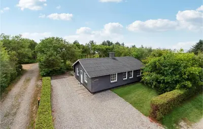 an overhead view of a black house on a gravel driveway at 3 Bedroom Lovely Home In Hurup Thy in Sønder Ydby