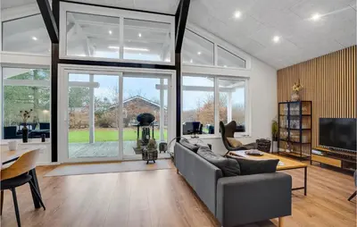 a living room with a couch and a table at Gorgeous Home In Thyholm With Wifi in Thyholm