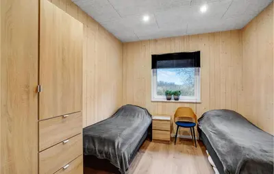 a bedroom with two beds and a window at Gorgeous Home In Thyholm With Wifi in Thyholm