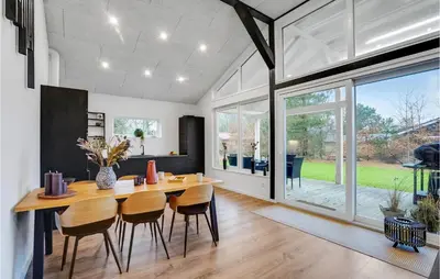 a kitchen and dining room with a table and chairs at Gorgeous Home In Thyholm With Wifi in Thyholm