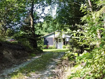 a small house in the middle of a dirt road at 4 person holiday home in Aars-By Traum in Års