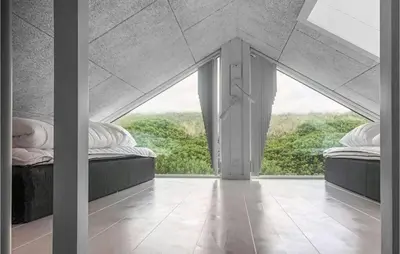 two beds in a room with a large window at Amazing Home In Harboøre With 4 Bedrooms, Sauna & Wifi in Harboør