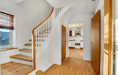 a hallway with a staircase in a house at Lovely Home In Thyborøn With Kitchen in Thyborøn