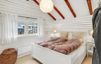 a white bedroom with a bed in a room with white walls at 3 Bedroom Cozy Home In Hurup Thy in Sønder Ydby