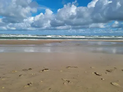 an image of footprints in the sand on a beach at 6 person holiday home in Pandrup-By Traum in Pandrup