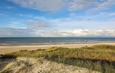 a view of a beach with the ocean in the background at Stunning Home In Løkken With Kitchen in Løkken