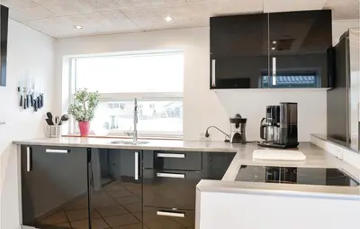 a kitchen with a sink and a counter top at Cozy Home In Lemvig With Wifi in Lemvig