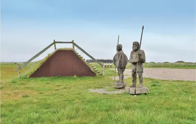 a statue of two people standing in a field at Cozy Home In Lemvig With Wifi in Lemvig