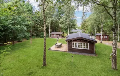 a small cabin in the middle of a yard at Holiday Home Jelsevej Ix in Højslev