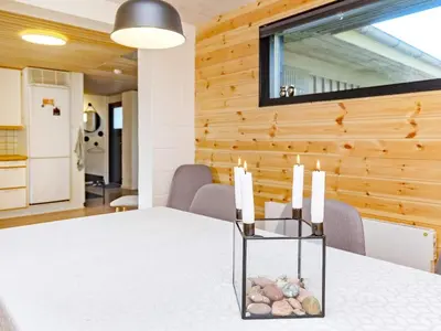 a dining room with a table with candles on it at 6 person holiday home in Vesløs-By Traum in Øsløs