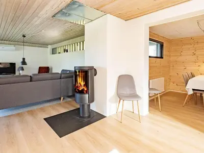 a fireplace in the living room of a house at 6 person holiday home in Vesløs-By Traum in Øsløs