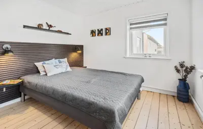 a bedroom with a bed and a window at 3 Bedroom Nice Home In Thyborøn in Thyborøn