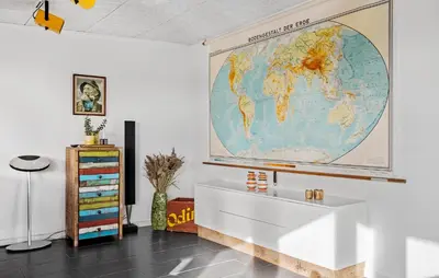 a large world map hanging on a wall in a room at 3 Bedroom Nice Home In Thyborøn in Thyborøn