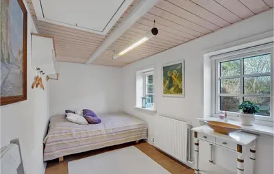a room with a bed and a sink in it at 3 Bedroom Gorgeous Home In Vestervig in Vestervig