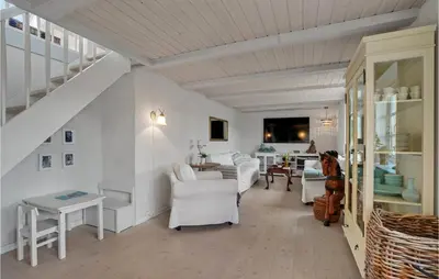 a living room with white furniture and a staircase at 3 Bedroom Gorgeous Home In Vestervig in Vestervig