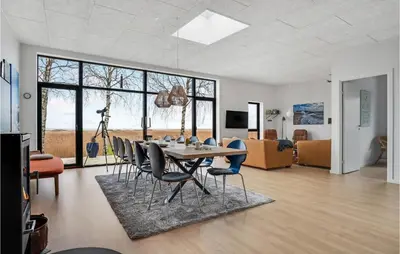 a dining room with a table and chairs at 4 Bedroom Gorgeous Home In Fur in Furland