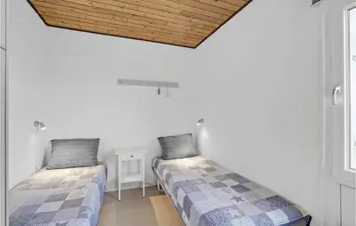 two beds in a room with white walls at Gorgeous Apartment In Vestervig in Vestervig