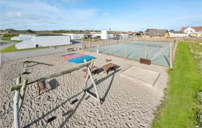an aerial view of a volley ball court and a tennis court at Gorgeous Apartment In Vestervig in Vestervig